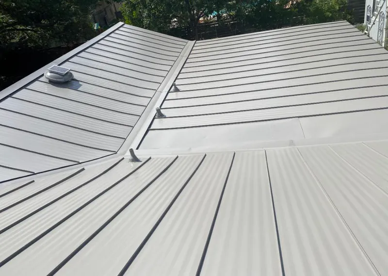 Solar attic fan installed on a metal roof for Roof Ventilation in Coconut Creek